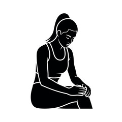 Woman in sportswear sitting and holding her knee.