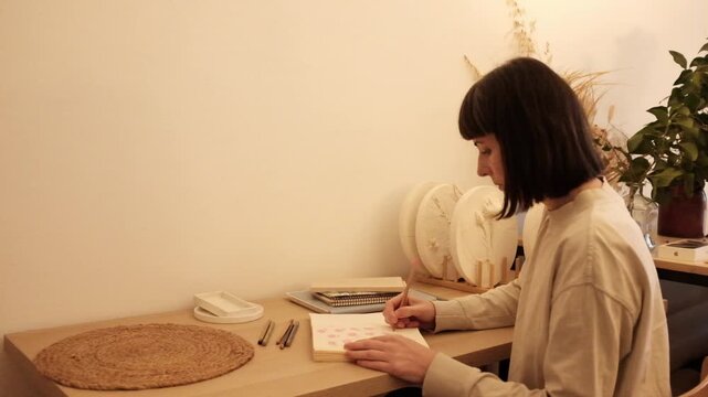 Beautiful light slow motion video. Gratitude journal, mental self care, mindfulness, self reflection, creatine writing. Concept of education, self planning, to do list.