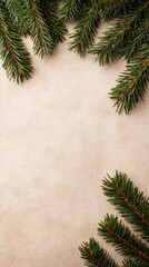 Minimal christmas background with green fir branches on beige surface creates calm festive mood for seasonal design and greeting card
