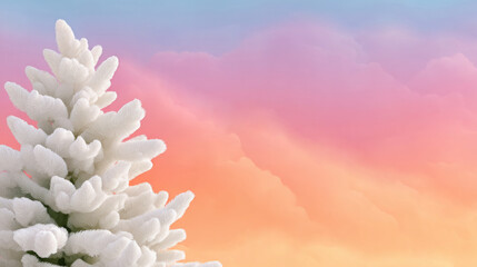 Fluffy snow-covered pine tree against a dreamy winter sunset sky with pink, orange, and blue clouds. Ideal for holiday greetings, winter travel blogs, and seasonal background graphics.