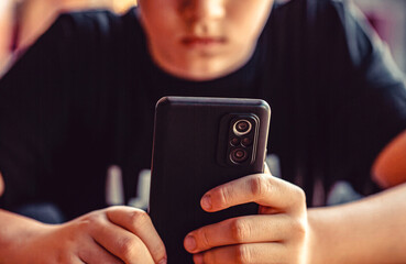 Mobile addiction, digital dependence concept. Child, teenager or preteen mobile phone