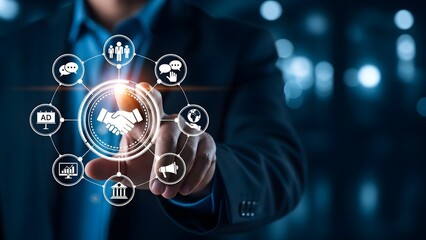 Close-up of a businessman interacting with a digital interface featuring various business icons on a dark background with a futuristic ambiance.