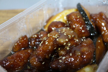 Food delivery: sweet and sour pork (Chinese cuisine)
