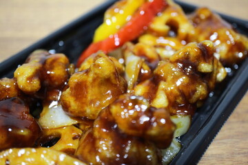 Black vinegar subuta (sweet and sour pork) purchased at a supermarket in Tokyo, Japan