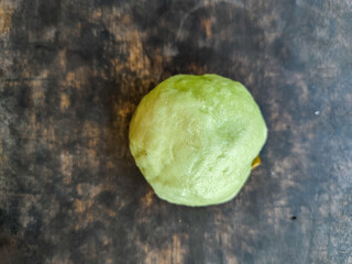 soft steamed buns filled with coconut enten on a wooden board