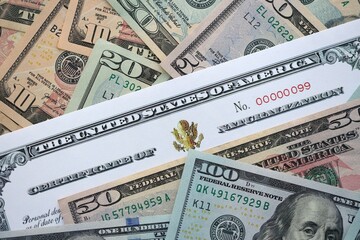 US Certificate of Naturalization on big amount of money bills close up