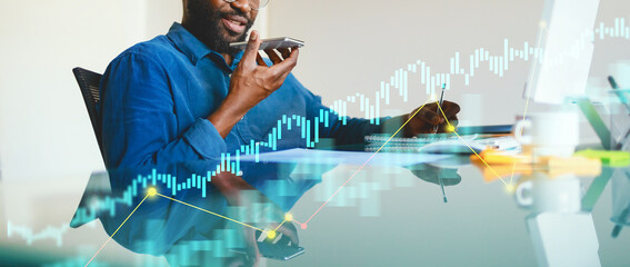 Business professionals engage with technology in a sleek workspace. They analyze data trends while taking notes and using a smartphone for communication. A visual graph enhances productivity.