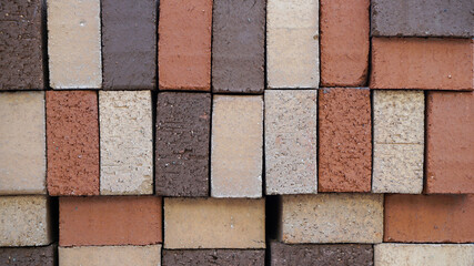 Stacked Black, Red, and White Rectangular Construction Blocks Texture Background
