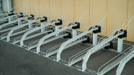 White metal bicycle parking space designed for organized and secure bike storage in public areas.