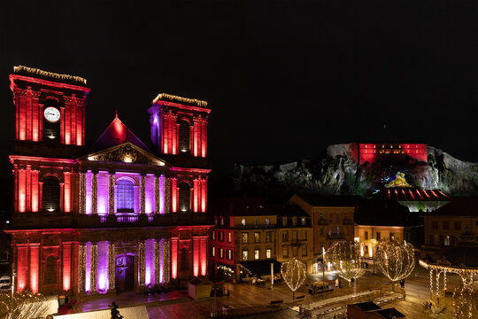 The lion monument, the Citadel, the Cathedral of Saint Christopher and the central square of the city of Belfort decorated before Christmas.
