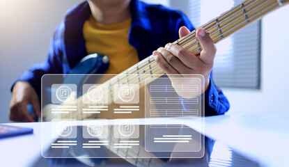 bass guitar practice concept with a man playing 4 string bass by jamming on electronic band on...