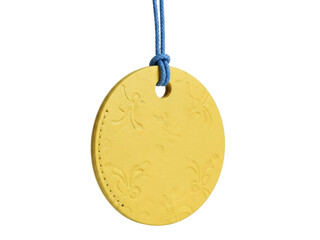 Isolated yellow leather embossed round pendant, blue cord, hanging, decoration, design, craft