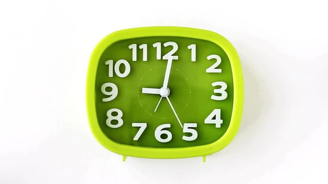 Bright lime-green square alarm clock with white hands and bold numerals on white background surface!