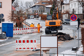 Excavator and Road Crew During Street Reconstruction