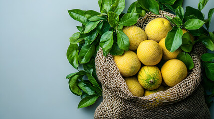 A basket overflowing with fresh, ripe lemons, placed on a blue wooden table; the vibrant yellow color of the lemons stands out