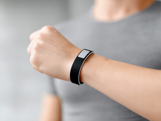 Fitness band on wrist close up, wearable technology for health tracking and exercise motivation