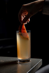 A delicious alcoholic cocktail at the bar. The bartender prepares cocktails