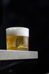 A delicious alcoholic cocktail at the bar. The bartender prepares cocktails