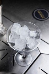 A delicious alcoholic cocktail at the bar. The bartender prepares cocktails