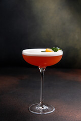A delicious alcoholic cocktail at the bar. The bartender prepares cocktails