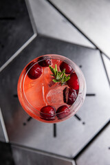 A delicious alcoholic cocktail at the bar. The bartender prepares cocktails