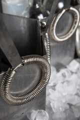 A delicious alcoholic cocktail at the bar. The bartender prepares cocktails