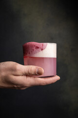 A delicious alcoholic cocktail at the bar. The bartender prepares cocktails