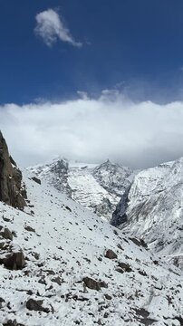 (Summits of the Greater Himalayas: Snow Peaks Glimmering Through Clouds (4K Dynamic Shot))