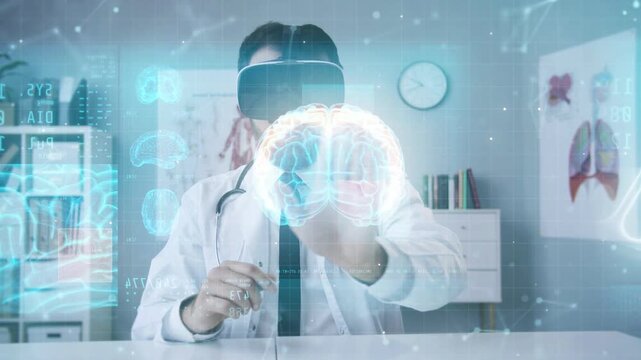 Male doctor wearing VR headset sitting in bright medical office. Checking patient health data on holographic images. Touching virtual brain model while analyzing information. Futuristic diagnostics.