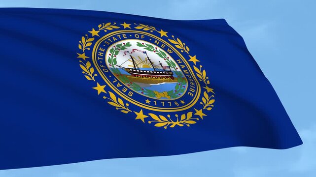 New Hampshire flag is waving against a clear blue sky.