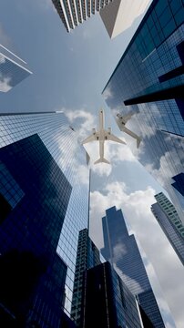Airplane Flying Over High-Rise Buildings in a Modern City Skyline