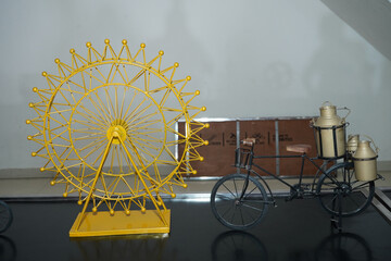 a beautiful cycle and gaint whele toy photo click by still