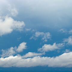 Tranquil Summer Sky with White Puffy Clouds and Copy Space