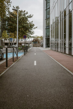A quiet Paris tunnel blends urban architecture with modern city mobility as empty road depth, street shadows and exterior pavement tones create a subtle atmosphere
