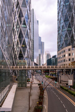 Urban details emerge across the empty Paris street as modern architecture blends with city mobility along quiet pavement and exterior road perspectives