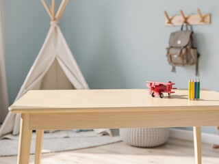Empty children’s desk mockup in primary school boy bedroom, clean wooden table top with minimal decor, bright and playful Scandinavian kids room background, perfect for stationery and toy product plac