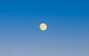 Full moon at sunrise or sunset