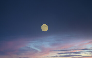 Full moon at sunrise or sunset