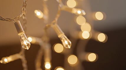 Closeup of warm white string lights with bokeh effect, festive holiday illumination christmas tree lights - Powered by Adobe