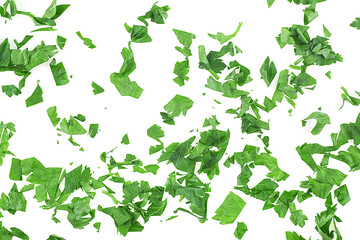 Chopped fresh parsley leaves isolated on a white background, top view. Green leaves of curly parsley.