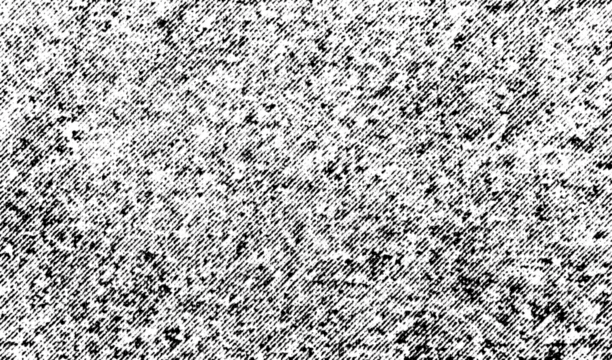 Macro halftone grain resembling cloudy sky, with dense diagonal speckles in black on a transparent background, creating rough abstract noise. - Powered by Adobe