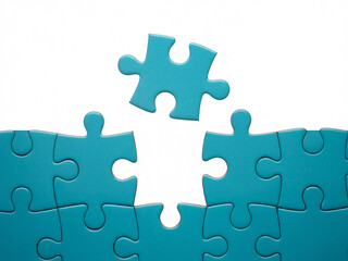 A single teal puzzle piece floating above a gap in a larger, incomplete puzzle, symbolizing missing parts or solutions on a white background.