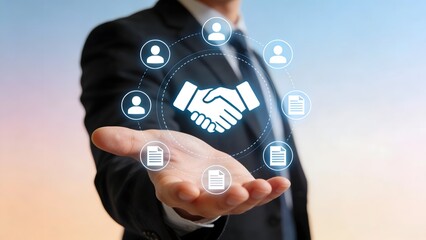 Businessman with handshake and icons