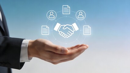 Business handshake icon over hand