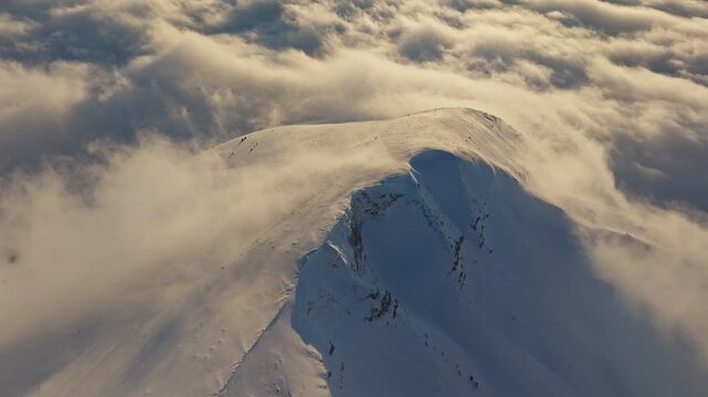 Majestic icy summits, Clouds circle icy mountain peaks, Fog envelops high and frosty mountains, Misty mists obscure towering cold summits beneath swirling clouds