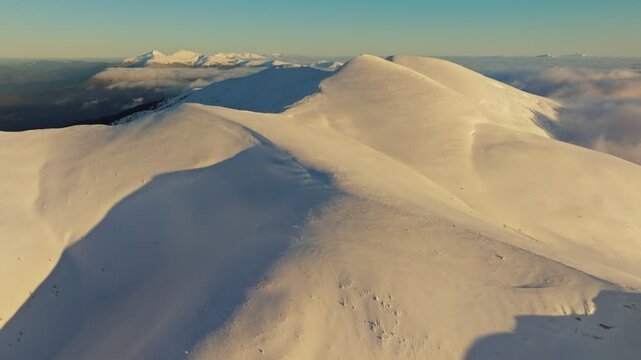 Gentle slopes with snowy textures, Windshaped hills adorned with sharp snow crystals, Radiant hills molded by breezes featuring smooth contours and icy crystal formations