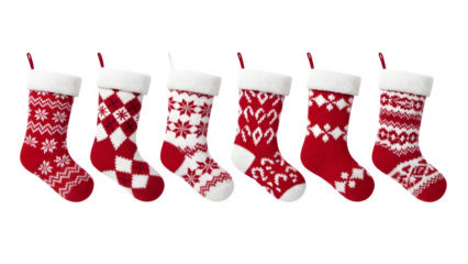 Collection of five red and white knitted christmas stockings hanging in a row isolated on transparent background