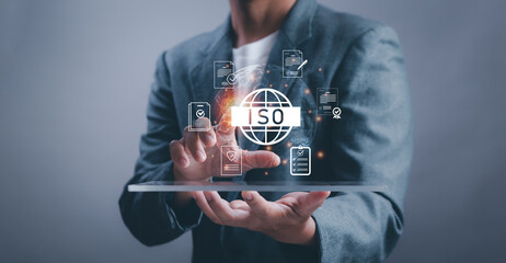 Businessman present ISO standard icons, representing international quality standards, document management, risk control concepts and organizational excellence for business credibility