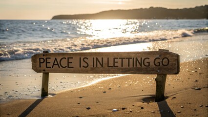 Wooden Sign Displaying "Peace Is In Letting Go" by the Ocean