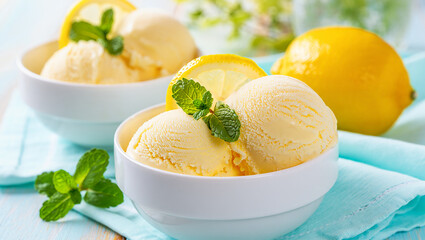 Ice cream with fruits mint lemon in a bowl on a plate